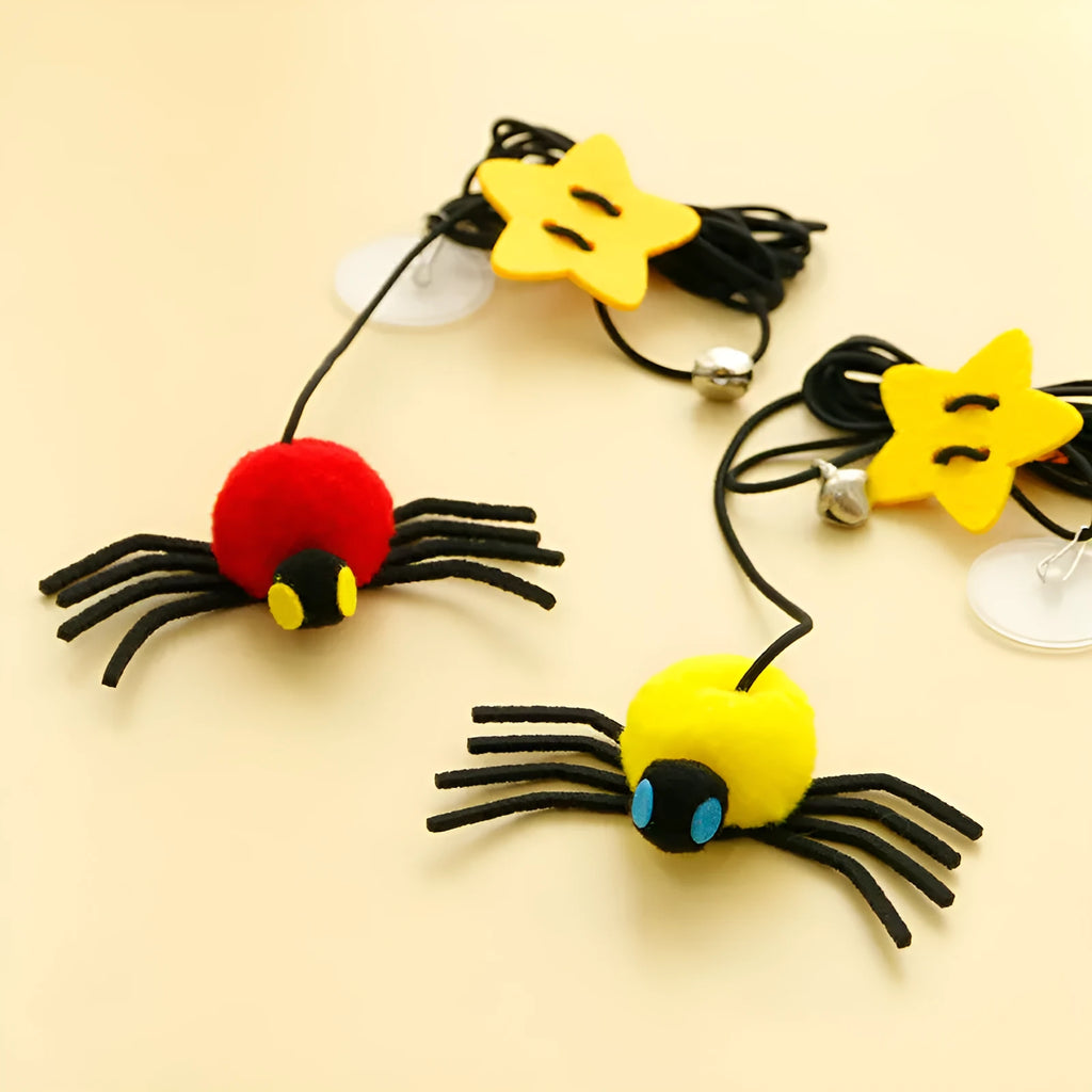 Hanging door cat toy with elastic rope, feather bell spider attachment in red colour